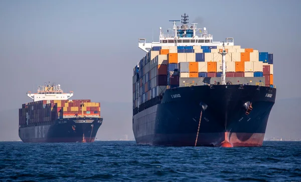 Two container ships on the water