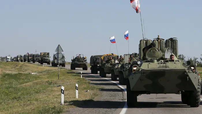Russian armored column crossing border — overhead drone shot